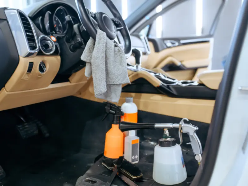 Car interior with cleaning supplies