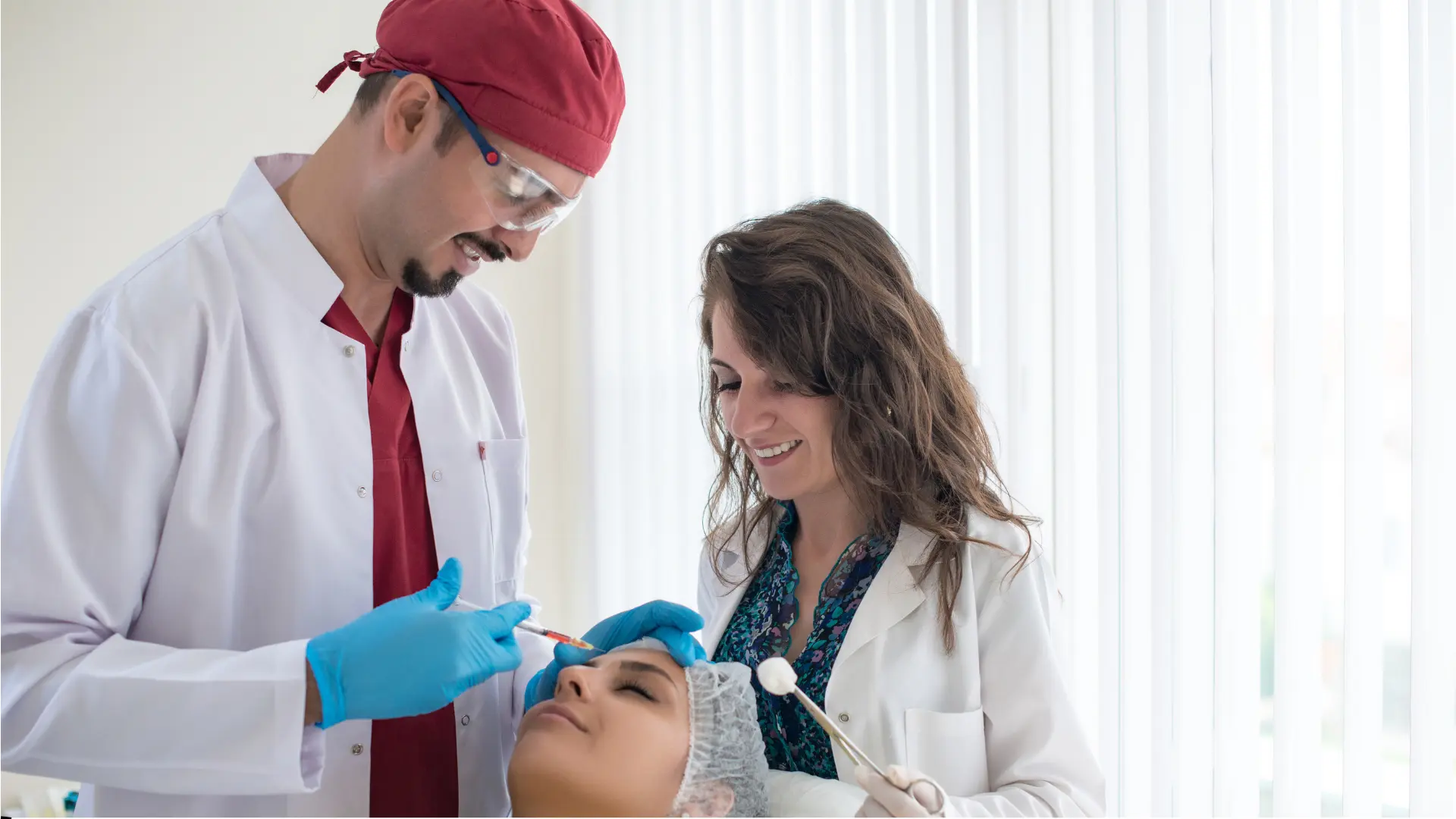 Doctors performing cosmetic procedure on patient