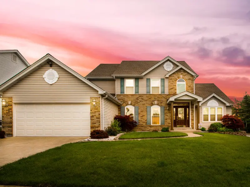 Charming suburban house at sunset.
