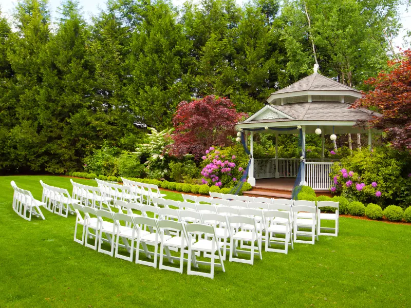 wedding venue internet marketing Outdoor wedding gazebo with chairs and lush garden