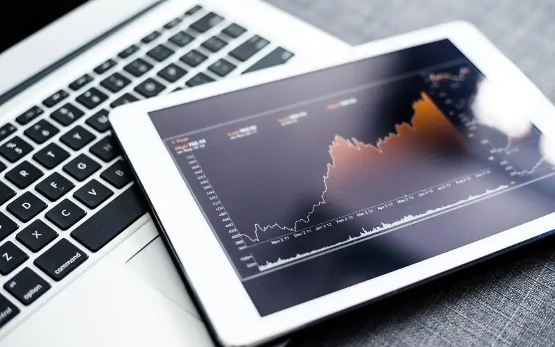 colorado marketing services Tablet displaying financial stock market graph.